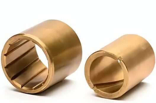 two cylindrical bronze parts in varying sizes